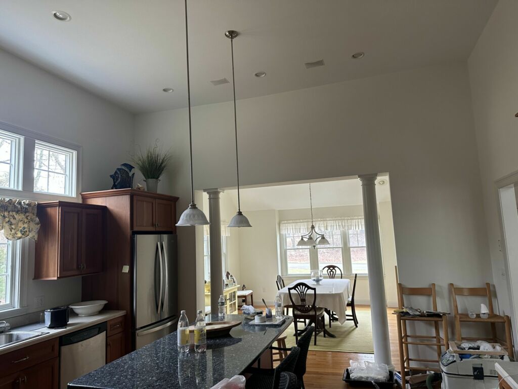 Kitchen and dining area interior painting by IAP Inc. for homeowner in Falmouth MA.