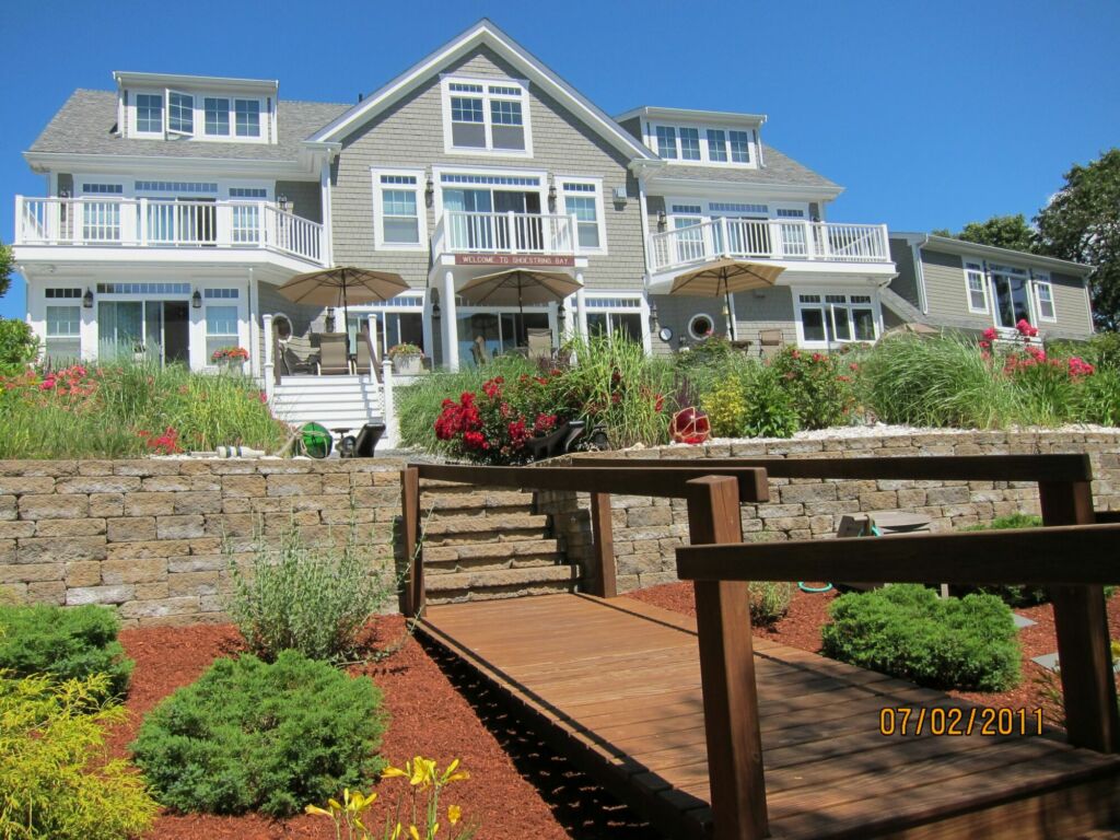 Exterior trim painted and maintained by IAP Inc. for Merlino Builder in Mashpee MA.