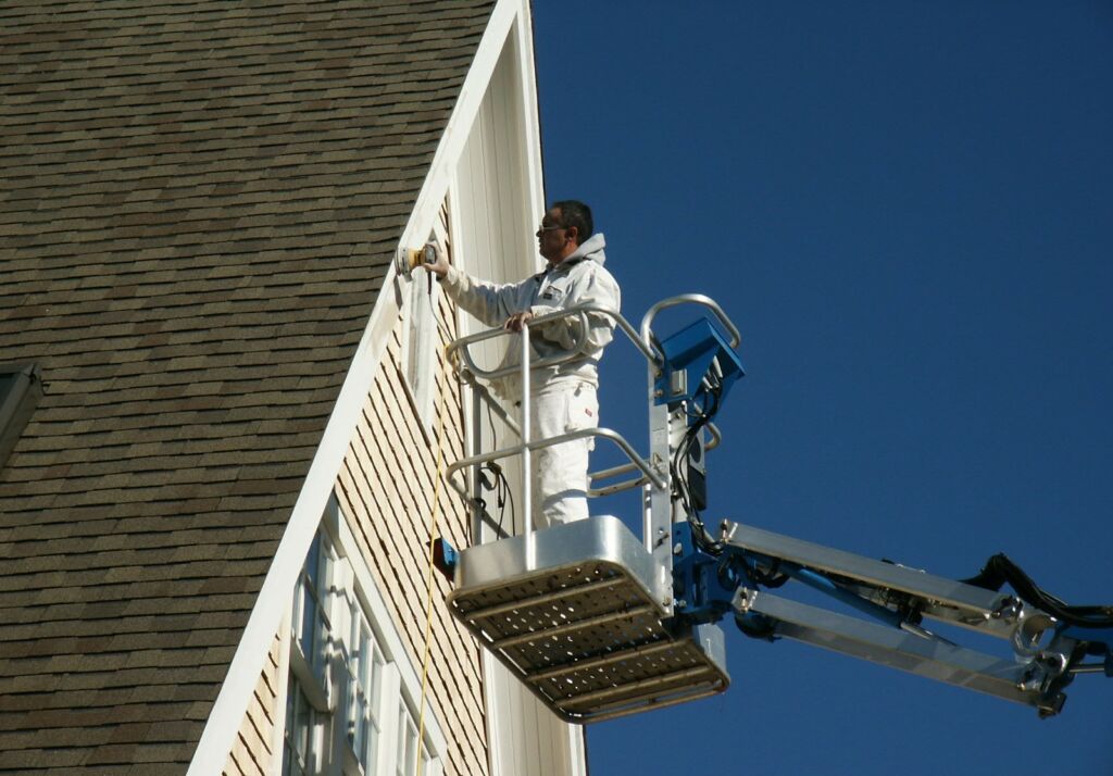 Detail Zoon Working top Lift. Exterior view of a home in Pocasset, MA, newly painted by IAP Inc for Sam Swift. Cape Cod style house with professional finish.