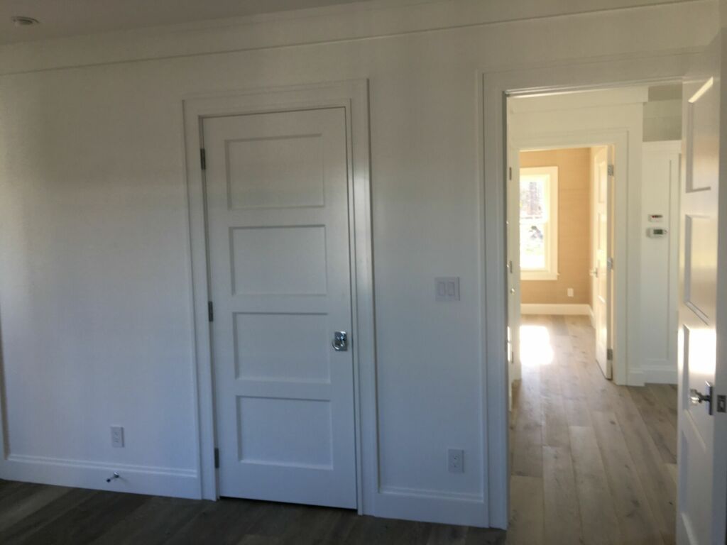 Bedroom interior trim painted and walls prepared for wallpaper by IAP Inc. in Woods Hole, Falmouth MA.