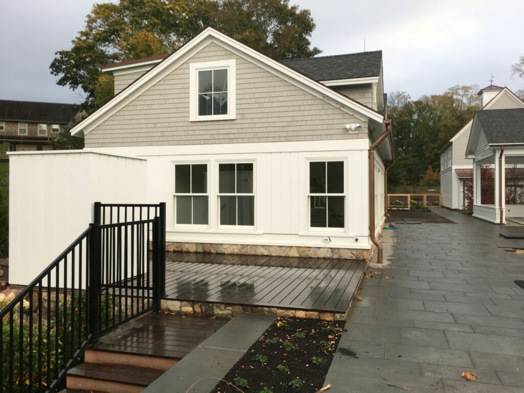 Exterior pool house painted by IAP Inc for Wellen Construction in Woods Hole, MA, 2015 with protective and vibrant finish.