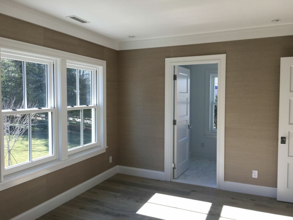 Bedroom interior trim painted and walls prepared for wallpaper by IAP Inc. in Woods Hole, Falmouth MA.