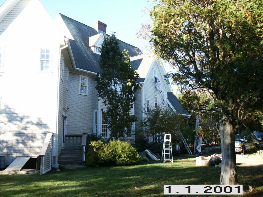 Back view of a Cape Cod home in Pocasset, MA, repainted by IAP Inc for Sam Swift, highlighting the rear exterior finish.