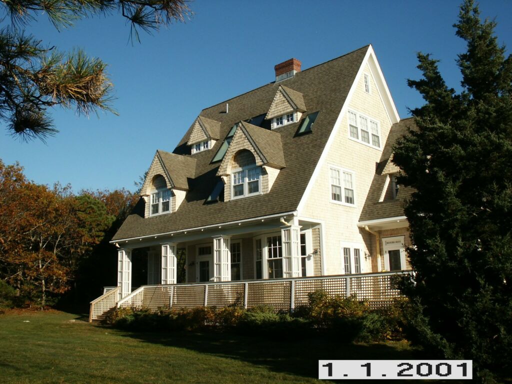 Exterior view of a home in Pocasset, MA, newly painted by IAP Inc for Sam Swift. Cape Cod style house with professional finish.