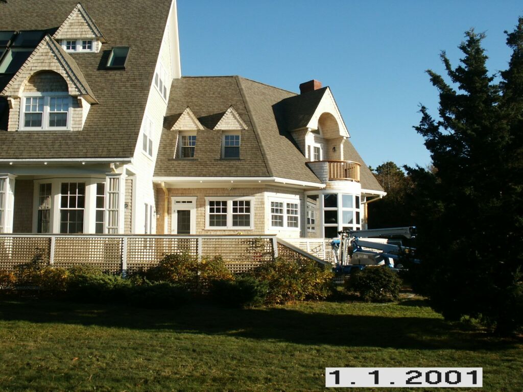 Exterior view of a home in Pocasset, MA, newly painted by IAP Inc for Sam Swift. Cape Cod style house with professional finish.